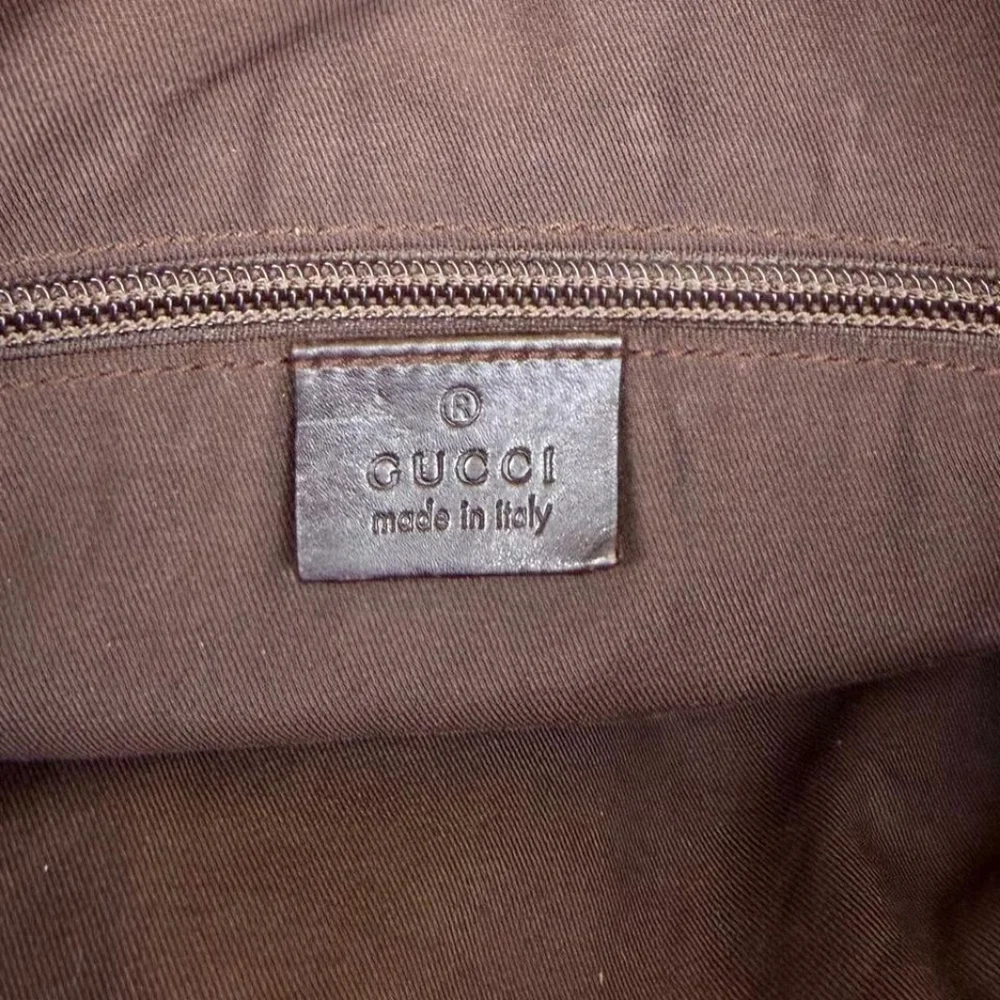 Gucci GG Monogram perforated leather messenger bag
